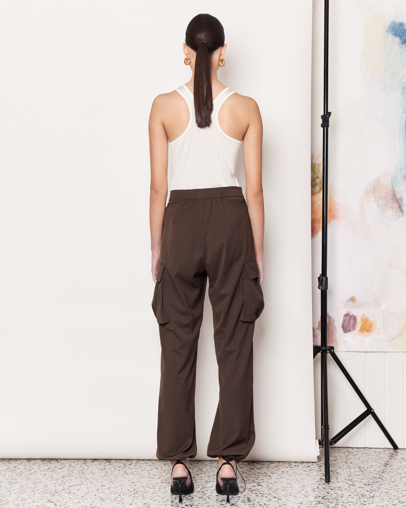 The Cargo Pants offer a modern twist on the 90s Cargo Pant with a parachute silhouette in a rich chocolate brown colour-way. Whether you are runnings errands or heading out for dinner, these pants provide ultimate comfort all day long and are a great addition to your wardrobe. Pair with a basic tee or tank for everyday wear. By Romy, now available at After Eight. 