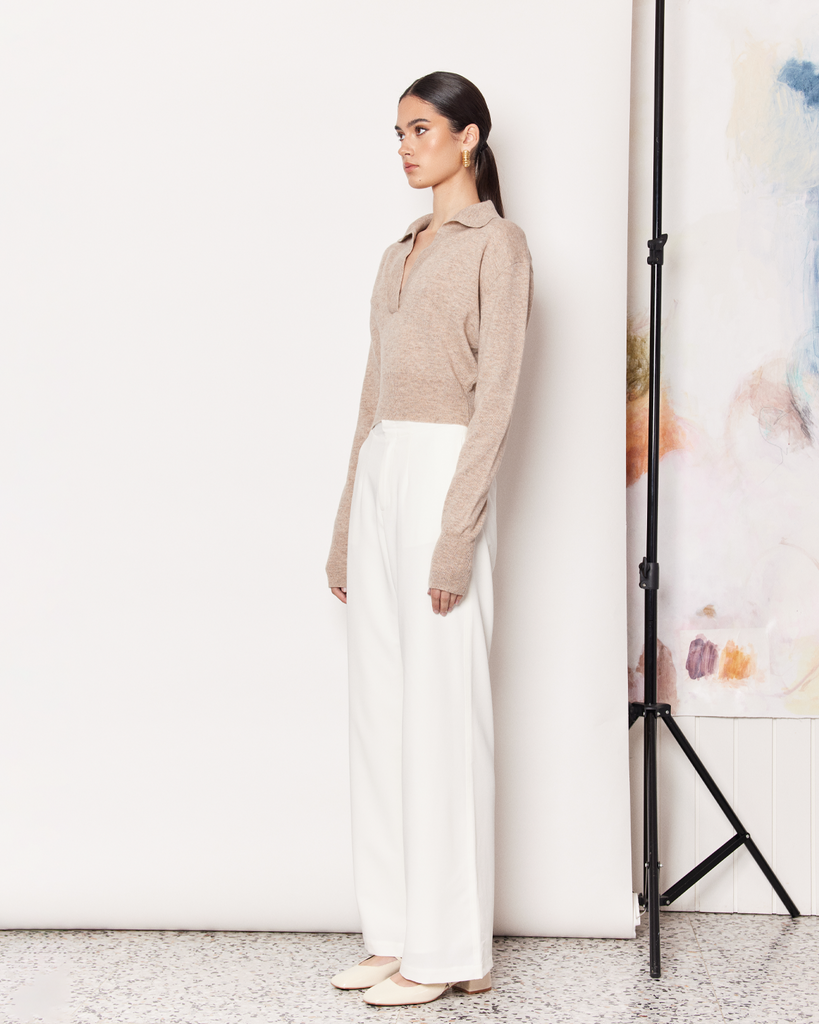 The Collared Sweater is a relaxed everyday knitwear essential in a versatile earthy hue. The perfect addition to your everyday wardrobe. Pair with jeans or a tailored white trousers for a chic office style. By Romy, now available at After Eight. 