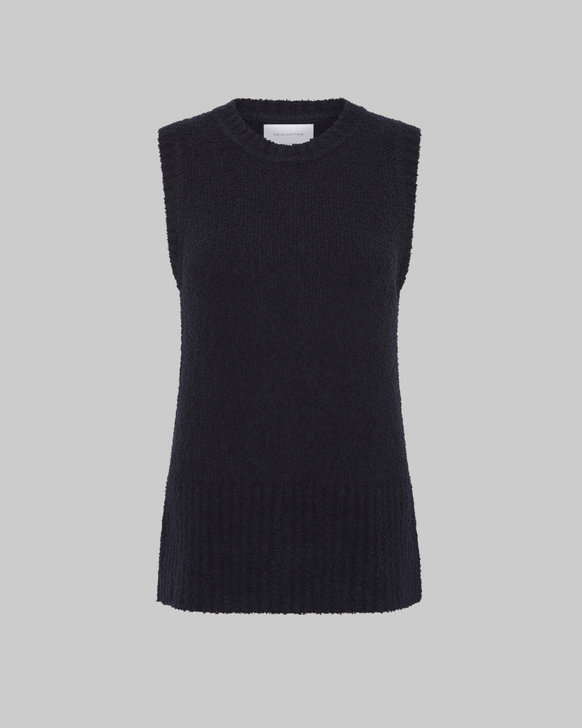 Effortlessly chic, the Celeste Tank promises versatility through its textured silhouette. Recognised for its boucle knit fabrication, it features a crew neckline, wide ribbed hem and side seam split for utmost comfort. By Friends with Frank, now available at After Eight. 