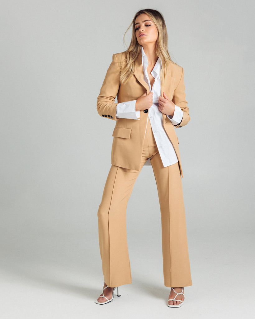 The Classic Blazer by Romy is the perfectly tailored piece. Pair yours back with the coordinating pants or shorts. By Romy, now available at After Eight. 