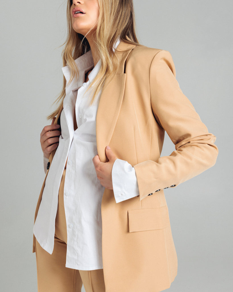 The Classic Blazer by Romy is the perfectly tailored piece. Pair yours back with the coordinating pants or shorts. By Romy, now available at After Eight. .