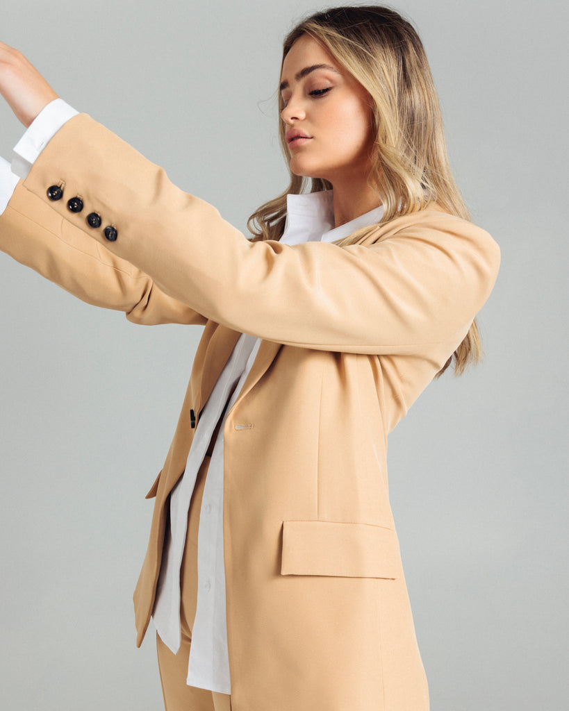 The Classic Blazer by Romy is the perfectly tailored piece. Pair yours back with the coordinating pants or shorts. By Romy, now available at After Eight. 