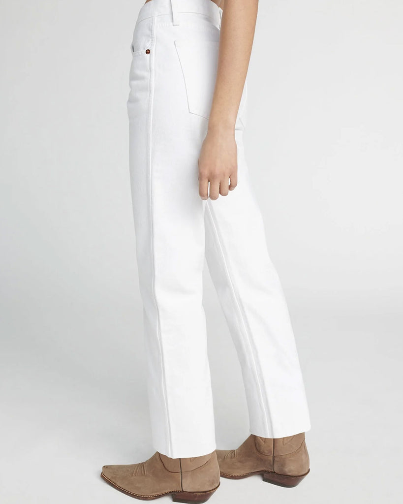 The 90s High Rise Loose in White is our take on the iconic long and loose denim from the 90s. Features a white wash in comfort stretch fabric a classic button fly, and a finished hem.   High rise fit sitting right below the natural waist with a fitted top block and loose leg. extended-length inseam with double-needle stitch detail at side seam. By Redone, now available at After Eight.