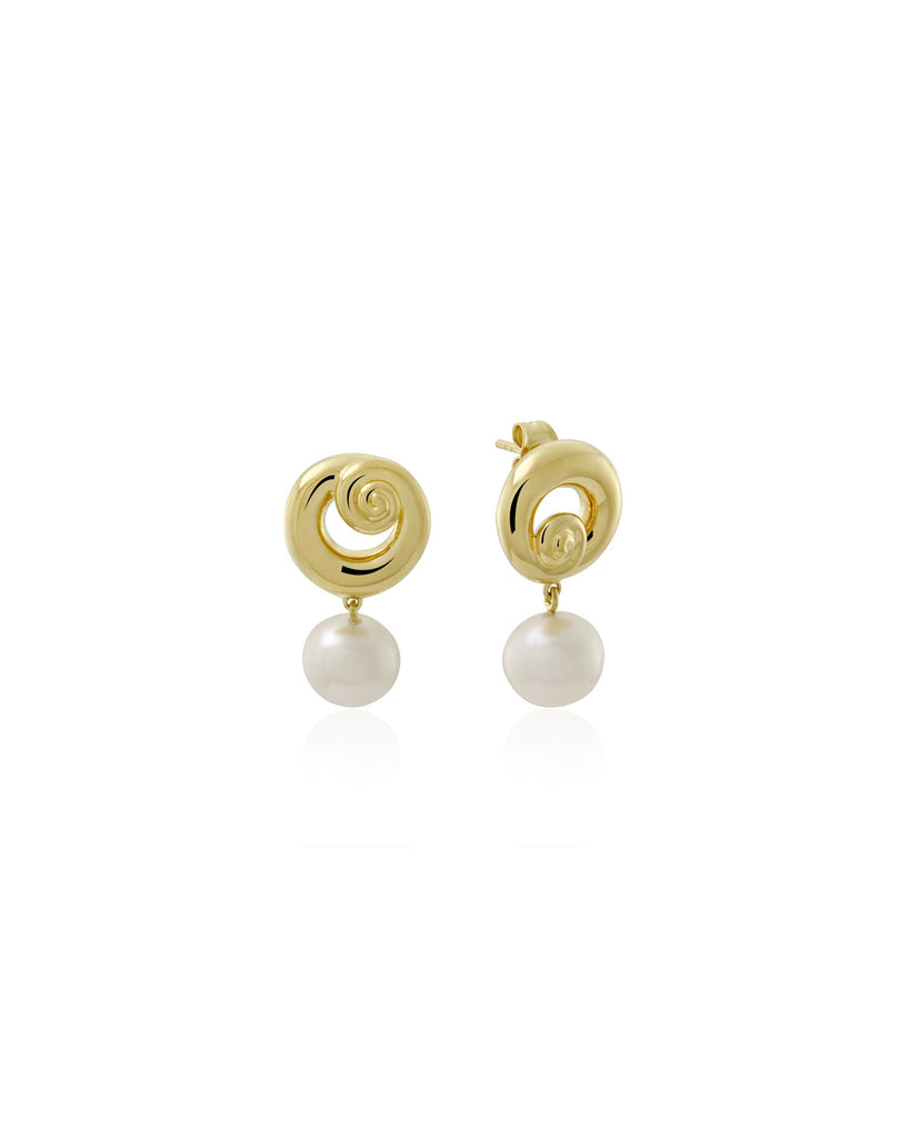 Pendulous white freshwater pearls, hung from a solid swirl stud. By Mineraleir, now available at After Eight. 